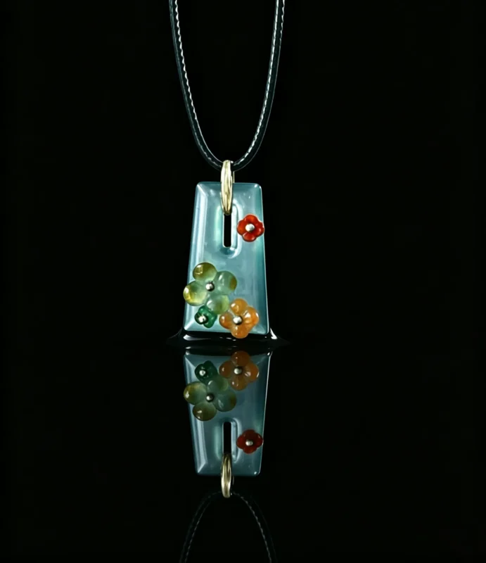 Ice‑blue jade hollow rectangle pendant with multi‑colour carved floral inlay, bespoke custom handmade jewellery, remake available with your preferred natural gemstone for birthstone design, black background studio shot